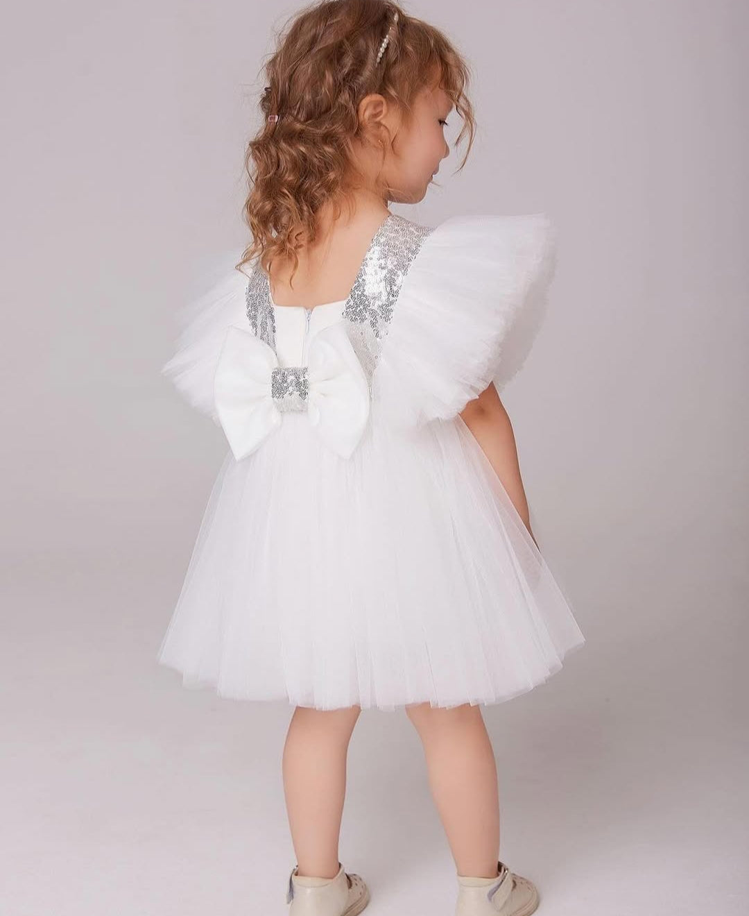 White Sleeveless And Sequins With Bow Embellished Frock For Girls